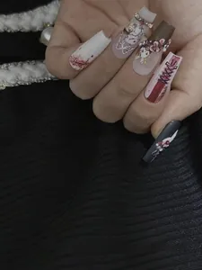 Macro detail of 3D embossed gothic rabbit nail stickers with floral patterns