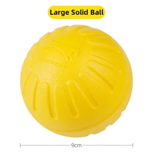 Detail view of 9cm yellow solid pet toy ball with durable textured surface for dogs