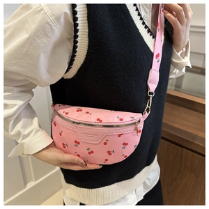 Pink crossbody bag with red cherry prints and matching shoulder strap for women