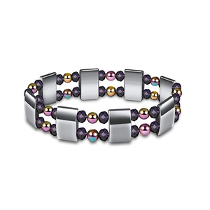 Detail of multi-strand magnetic yoga bracelet with silver links and purple faceted beads