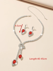 Detail view of water drop jewelry set with red gemstones and dimension markings