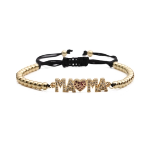Adjustable golden bead MAMA heart bracelet with micro-pave cubic zirconia on white background