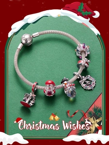 Detail of Christmas themed charm bracelet with Santa Claus and snowman charms in S925 silver