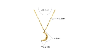Macro detail of hammered crescent moon pendant on gold plated stainless steel chain