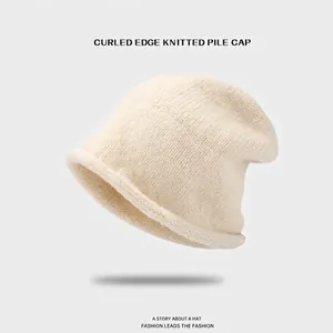 Beige ribbed knit slouchy beanie for women with rolled edge design for autumn and winter