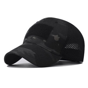 Detail of tactical camouflage baseball cap showing front hook-and-loop patch and breathable mesh