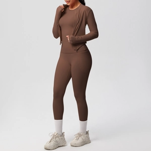 Detail of dark brown yoga set with thumbholes, side pockets, and slim fit zip jacket