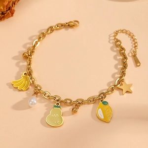 Golden chunky chain bracelet with enamel fruit charms, pearl, and star pendant