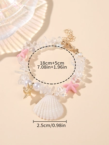 Detail showing shell pendant and starfish beads on a beach style bracelet with dimensions