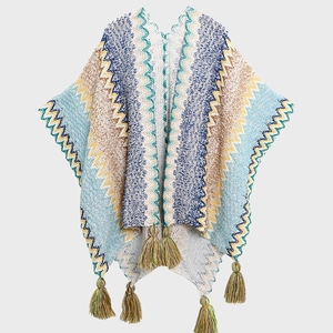 Ethnic knit shawl wrap with colorful wave pattern and tassels for travel outfits