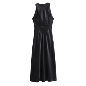 Detail of elegant black sleeveless halter satin midi dress with silky gloss finish