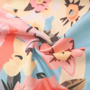 Close-up of floral print maternity dress fabric showing soft texture and colorful patterns