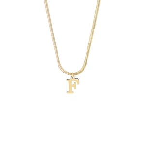 Detail of 18K gold snake chain necklace featuring a minimalist letter F pendant charm