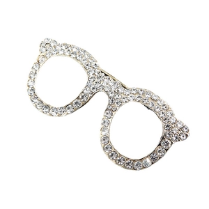Stylish gold spectacles brooch featuring sparkling inlaid crystals on a white background