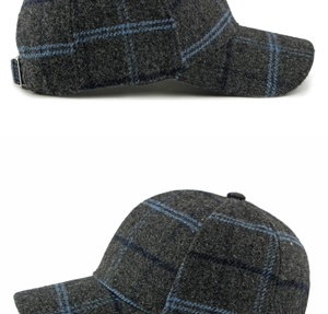 Detail of dark grey plaid wool baseball cap showing metal buckle and blue checkered pattern