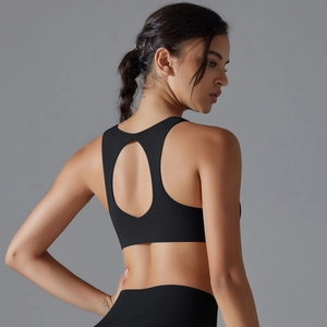 Detailed back view of a black sports bra featuring a hollow-out cutout and racerback design