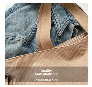 Detailed close-up of corduroy tote bag showing stitching and woven canvas strap texture