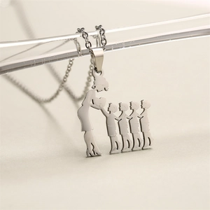 Detail of silver stainless steel mother and four children silhouette heart necklace