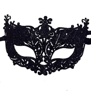 Detail of black sequined masquerade mask showing intricate hollow texture and ties