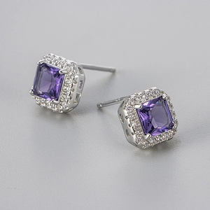Macro detail of S925 sterling silver square purple zircon halo stud earrings