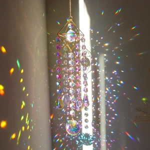 Crystal suncatcher with geometric frame and prism balls creating rainbow light effects