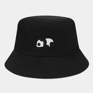 Close-up detail of cute panda embroidery on a black cotton bucket hat with stitching