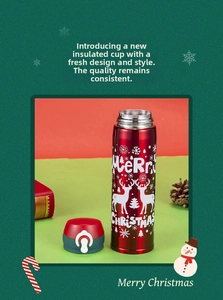Detail view of red Christmas stainless steel thermos with reindeer and snowflake patterns