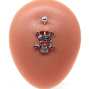 Silver skull belly button ring with black and red crystals on silicone model