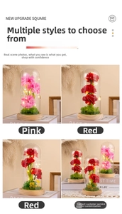 Close-up of artificial carnations in a glass dome with LED lights and wooden base