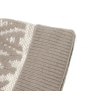 Close-up of Norway jacquard knit hat showing camel and beige fibers with ribbed edges