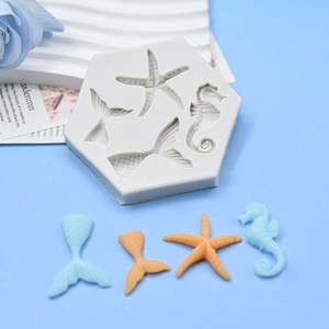 Macro view of ocean themed silicone mold with seahorse starfish and fish tail cavities