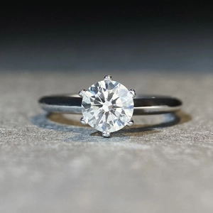 Macro shot of 925 silver ring featuring round D-color moissanite in six-prong setting