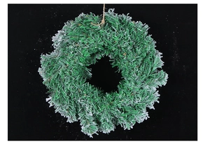 Detailed close-up of a snow-flocked PVC Christmas wreath with hanging rope