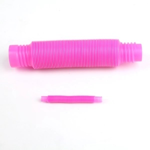 Close-up of pink plastic pop tubes in two sizes with flexible corrugated texture