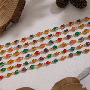 Romantic gold jewelry set with colorful enamel heart charms and shell details
