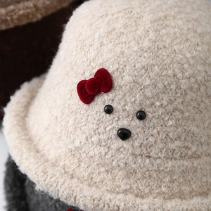 Winter plush cream bucket hat for kids with red bow and animal face detail