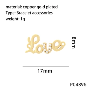 Macro view of gold-plated Love letter charm with sparkling zircon inlay for bracelets