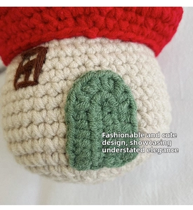 Macro detail of hand-knitted mushroom bag with crochet stitches and 3D door design