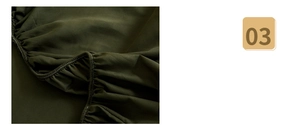 Detail of dark olive green fitted sheet showing elastic band and durable stitching