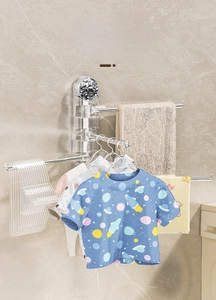 Close-up of swivel towel rack with multiple metal arms showing wall-mount suction feature