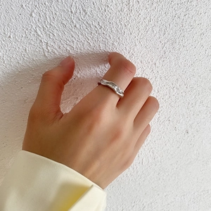 Close-up of S925 sterling silver ring featuring unique irregular wavy texture details