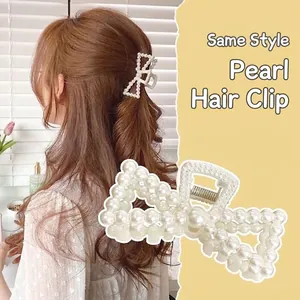 Elegant bow-shaped hair claw clip fully covered in white pearls for women's hair styling