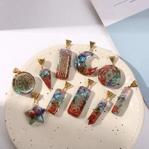Various Orgone crystal stone pendants featuring Tree of Life in colorful resin charms