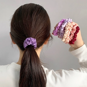 Elegant satin hair scrunchies set for women shown on a ponytail in various silk colors