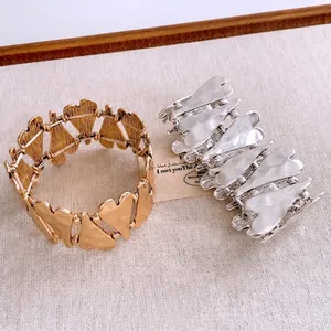 Lava texture heart-shaped wide elastic bracelets in polished gold and matte silver finishes