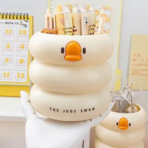 Round cream-colored cartoon duck pen holder with tiered wave structure for desk storage