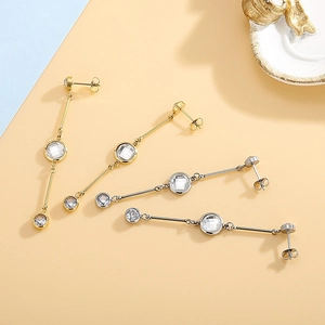 Elegant long tassel earrings with geometric crystals in gold and silver finish