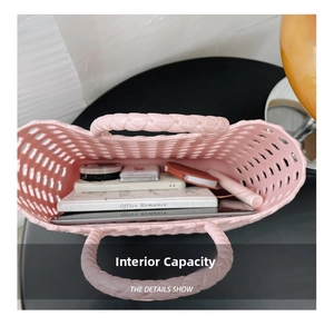 Detailed interior of a pink woven basket bag showing capacity for tablet and phone