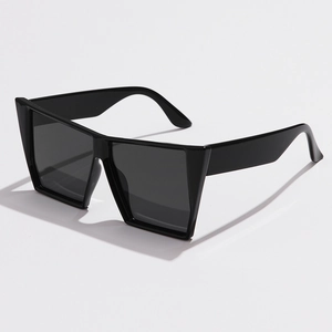 Futuristic oversized square sunglasses in glossy black resin with geometric frame