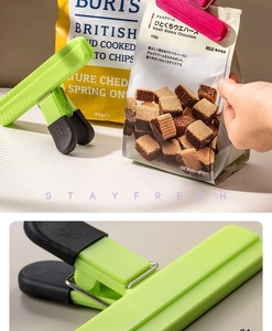 Close-up of T-shaped food sealer clips with non-slip grips on snacks packaging